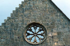 Valle Crucis Abbey, Cistercian abbey founded 1201, dissolved 1537, west gable of church with rose window and latin inscription, Llantysilio, Denbighshire, Wales