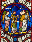 St Denis carrying his head, Lincoln Cathedral, 13th century stained glass