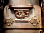 Misericord of beast and child, Great Malvern Priory, Worcestershire