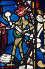 Detail of Satan surrendering the bond to the Virgin 13th century stained glass, east window Lincoln Cathedral, Lincoln, England
