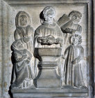Baptism, carved panel on fifteenth century Seven Sacraments font, St Bartholomew