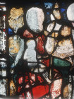 Eve and child, detail from Adam delving and and Eve spinning, fifteenth century, Great Malvern Priory, Worcestershire, England