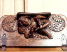 Misericord in Wells Cathedral, Somerset, seventeenth century, boy drawing thorn from his foot