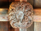Green Man roof boss, carved in wood, on nave ceiling, Church of St Andrew, South Tawton, Devon, England
