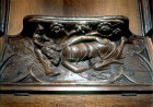 Misericord in Gloucester Cathedral, Delilah cutting off Samson