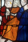 Moses, seated, during  battle with the Amalekites, sixteenth century Flemish panel in the south east window of the Lady Chapel, Exeter Cathedral, Devon, England