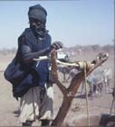 Tuareg serf drawing water, Agadez, Niger