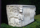 Fluted Roman sarcophagus, circa 200-250, with lion accompanied by keeper tearing humped cow to pieces, bought in Rome, Cliveden House, Buckinghamshire, England