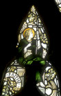 Faith, one of three theological virtues, by Powell, nineteenth century, tracery of window 3, south nave aisle, Exeter Cathedral, England