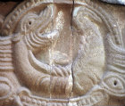 Carving of monster over south door, twelfth century, Church of SS Mary and David, Kilpeck, Herefordshire, England