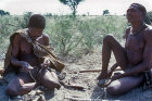 Bushmen, Ramonne making snake rattles, Be-tee playing thumb piano, Kalahari, Southern Africa