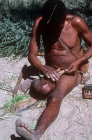 Bushman Ramonne making string, Kalahari, Southern Africa