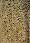 Detail of foliate carved decoration enclosing seated deities, Angkor Wat temple built 1113-52 AD by Suryavarman II, Hindu (Vishnu) Cambodia