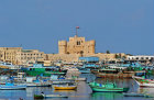 Egypt, Alexandria, Fort Quaitbey, built 1477 by Mamluk Sultan al-Ashraf Sayf ad-Din Quaitbey on site of ancient Pharos, and boats in Eastern harbour