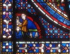 Butcher (a donor), Miracles of Mary window, circa 1210, Chartres Cathedral, France