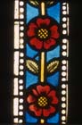 Rose border in shoemakers window, 14th century stained glass, Freiburg Munster, Germany