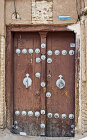 Wooden door with male and female knockers, Yazd, Iran