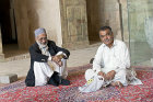 Masjed-e Jameh, Seljuk, oldest mosque in Iran, two men in north iwan, Isfahan, Iran