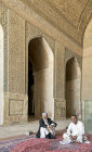 Masjed-e Jameh, Seljuk, oldest mosque in Iran, two men in north iwan , Isfahan, Iran