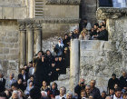 Israel, Jerusalem, crowd outside the Holy Sepulchre Church watching Maundy Thursday feet washing