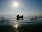 Fishermen on the Sea of Galilee at sunrise, Israel