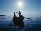 Fishermen at sunrise on the Sea of Galilee, Israel