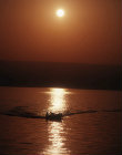 Fishing boat at sunrise on Sea of Galilee, Israel