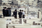 Israel Jerusalem mourners visiting grave in the Jewish Cemetery on the Mount of Olives  Ashkenazi Jews