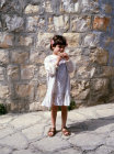 Israel Little Jewish girl eating Matzo at Passover