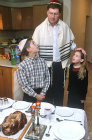 Israel, Friday Night, a Jewish father blesses his children before the Shabbat meal