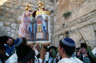 Israel Jerusalem Religious Jews pray around a Torah scroll at the Western Wall during the festival of Sukkot