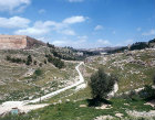 Israel, Jerusalem looking north up the Kidron Valley and the south east city wall seen from  Silwan Village with the Chruch of All Nations in the distance