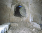 Rock-cut tomb with rolling stone, seen from inside, Bethphage, Israel