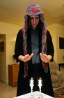 Israel Jerusalem a Jewish woman lighting Sabbath candles at home