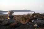 Israel, boundary marker stones north of Beersheva, mist in the valley beyond