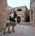 Israel, Jerusalem, Arab on a donkey in the old city