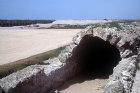 Low-level covered aqueduct, with high-level aqueduct left background, Caesarea, Israel