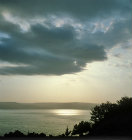 Israel, storm clouds over the Sea of Galilee near Capernaum, shortly after sunrise
