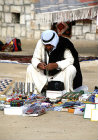 Israel, Beersheva, Bedouin market, Bedouin man checking his wares