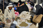 Israel, Beersheva, market, Arab selling grain to Bedouin woman