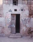 House with paintings over doorway signifying inhabitants have made pilgrimage to Mecca, near Temple area, Jerusalem, Israel