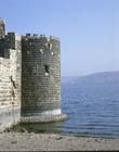 Tower on shore of Lake Galilee, with Golan heights in the distance, Tiberias, Israel