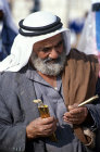 Israel, Beersheva, Bedouin market, Bedouin examining a dagger