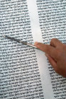 Israel Hod Hasharon, a Rabbi  holding the Yad whilst reading from the Torah