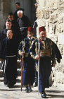Easter Sunday procession to Church of the Holy Sepulchre, two Turkish guards and Franciscan monks, Jerusalem, Israel
