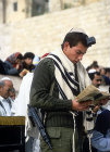 Israel, Jerusalem, an Ashkenazi Israeli soldier carrying his gun whilst praying at the Western Wall