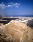 Israel, Masada, aerial long shot from south south west of the ancient fortification on the eastern edge of the Judean desert  with the Dead Sea beyond