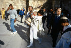 Israel Jerusalem Sephardic Jewish boy carrying the Torah scroll of the law at the Western Wall