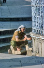 Israel, Jerusalem, Muslim at the Ablutions Fountain before praying