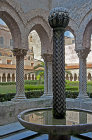 Cloisters and fountain, Monreale Cathedral, dedicated to Assumption of Virgin Mary, begun by Norman King William II in 1174, Monreale, Sicily, Italy
